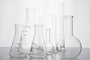 laboratory glass tube on the surface HD wallpaper
